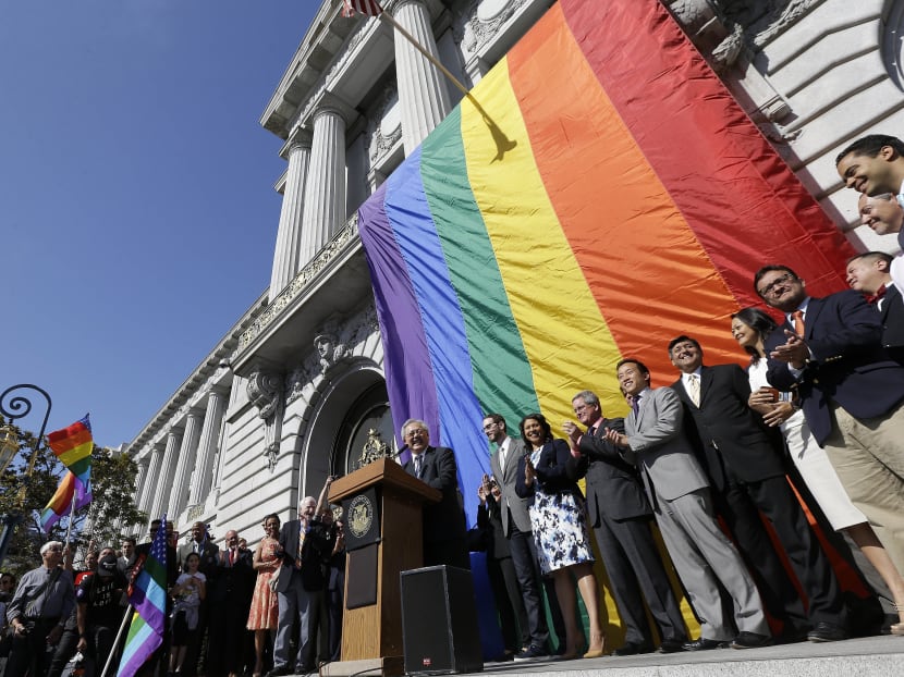 San Francisco Mayor Ed Lee (centre) speaks at a news conference outside of City Hall in San Francisco, Friday, June 26, after the US Supreme Court ruled that  same-sex couples have the right to marry nationwide. Photo: AP