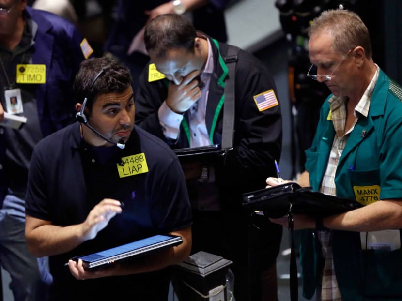 Traders work in the oil options pit at the New York Mercantile Exchange, Wednesday, July 3, 2013. Oil climbed above US$101 a barrel as the political crisis in Egypt intensified. Photo: AP
