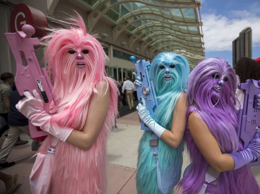 Star Wars enthusiasts wear costumes resembling what they say are three "Chew's Angels" during the 2015 Comic-Con International Convention in San Diego, California July 10, 2015. Reuters file photo