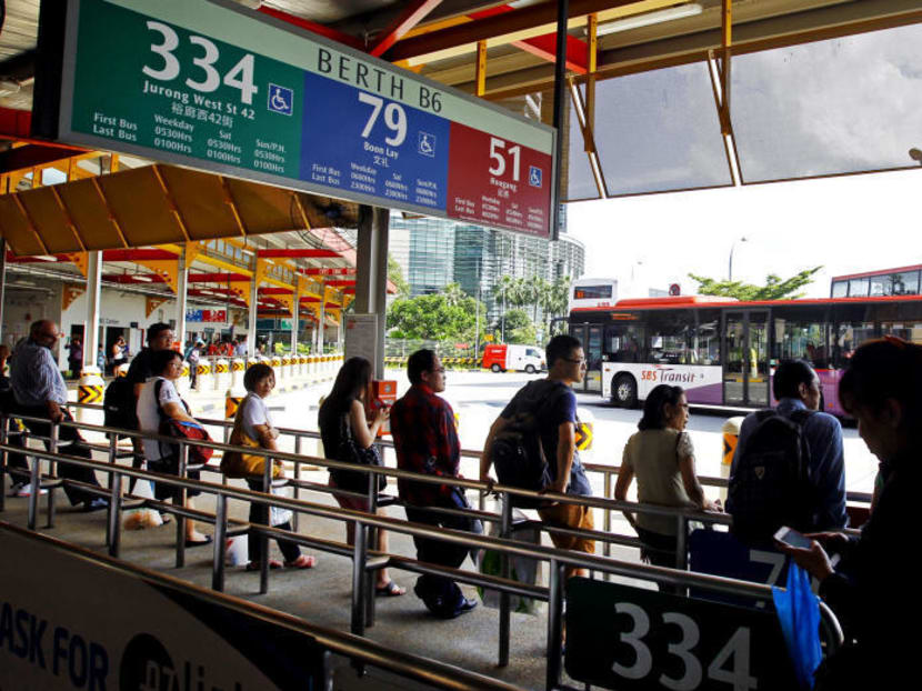 Commuters waiting for buses at Jurong East bus interchange on June 20, 2014. Photo: Ernest Chua