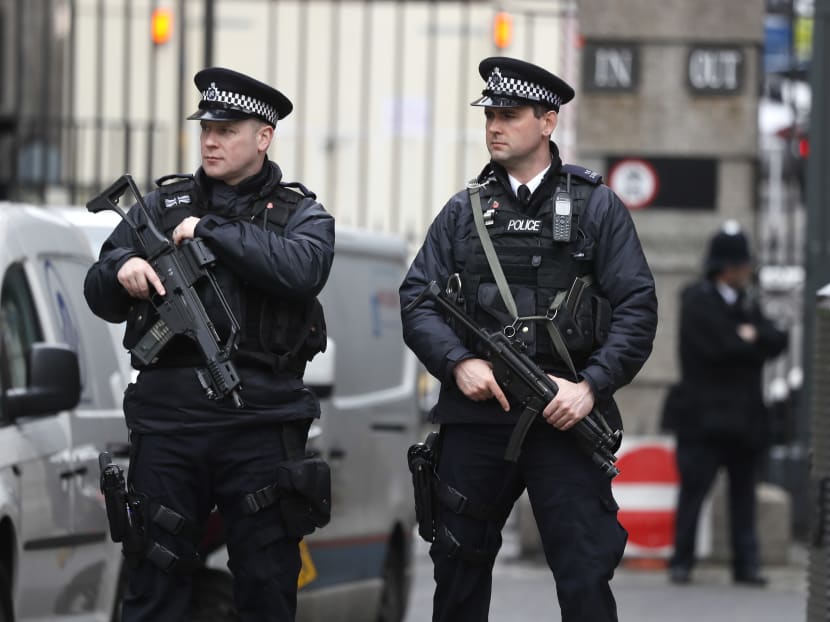Armed police officers standing guard near the Houses of Parliament in London, on March 23, 2017. Photo: AP
