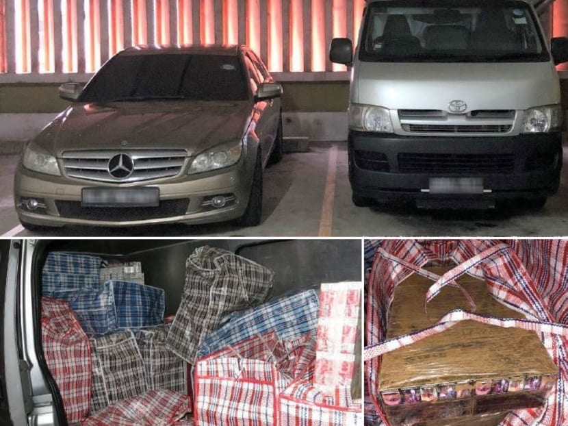 A total of 1,375 cartons of duty-unpaid cigarettes were seized from the silver van parked in a multi-storey car park in East Coast Road. Photo: Singapore Customs