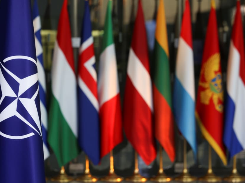 National flags of members of the Nato are seen, on the day of a foreign ministers meeting amid Russia's invasion of Ukraine, at the Alliance's headquarters in Brussels, Belgium on March 4, 2022. 
