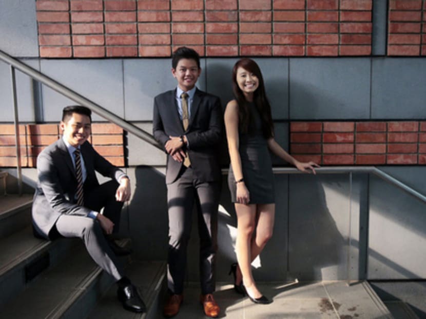 SMU students (from left) Don Teo, Rodney Tan and Zoey Lee have developed a web-based monitoring system called SupplyWatch that will enable VWOs to tailor their food rations to the specific needs of their beneficiaries. PHOTO: JASON QUAH