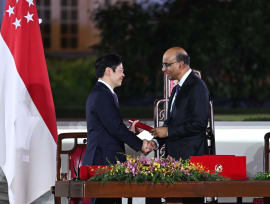 President Tharman Shanmugaratnam (right) shaking hands with newly sworn-in Prime Minister Lawrence Wong as he presented Mr Wong with the Instrument of Appointment, at the Istana on May 15, 2024. 