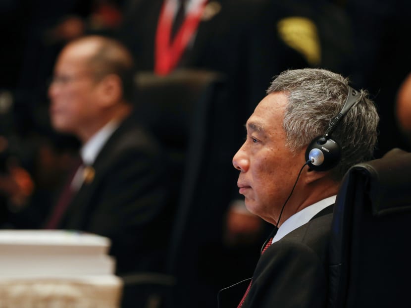 Prime Minister Lee Hsien Loong, right, and Philippines Benigno Aquino III listens during the 27th Association of Southeast Asian Nations (ASEAN) summit in Kuala Lumpur on Nov 21, 2015. Photo: AP