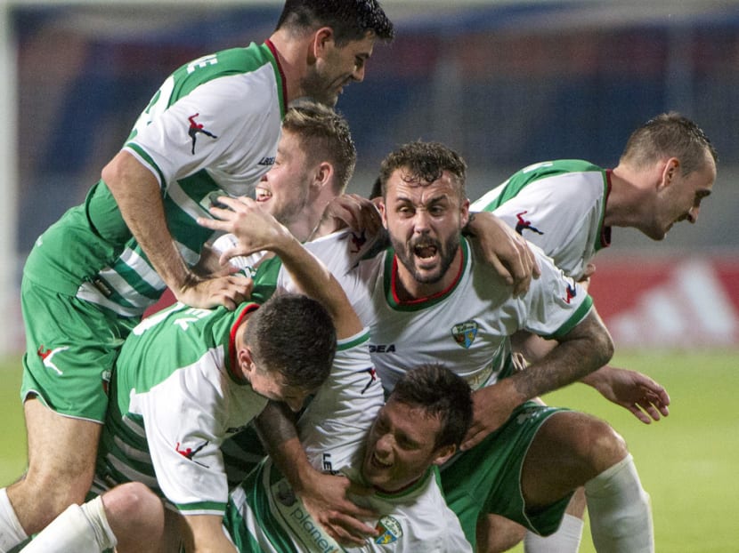 The New Saints of Wales celebrating their goal against Videoton FC of Hungary during a Champions League 

match in 2015. The club’s reward for reaching the first qualifying round of the Champions League this season is five times the salary bill of almost every other Welsh club.

Photo: MTI via AP
