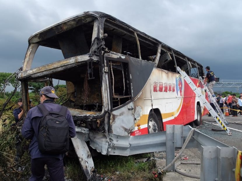 A bus carrying tourists from mainland China crashed and caught fire on its way to the airport in Taiwan's city of Taoyuan on July 19, 2016. Photo: AFP