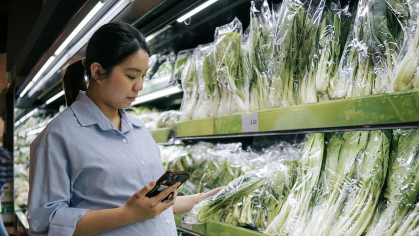 woman buying vegetables supermarket