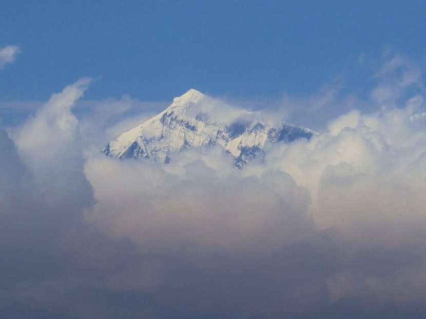 The summit of Mount Everest shrouded in cloud.