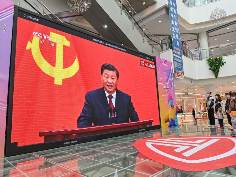 People watching a live broadcast of China's President Xi Jinping speaking during the introduction of the Communist Party of China's Politburo Standing Committee, at a shopping mall in Qingzhou, on Oct 23, 2022. People watching a live broadcast of China's President Xi Jinping speaking during the introduction of the Communist Party of China's Politburo Standing Committee, at a shopping mall in Qingzhou, on Oct 23, 2022.