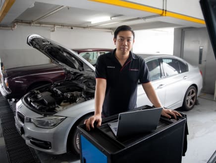 Motor Edgevantage’s tuning specialist, Mr Nicholas Lee, 27, poses for a photo at the workshop, located in Sin Ming AutoCity, on June 28, 2023.