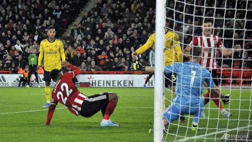 Football: Arsenal slump to defeat at Sheffield United Football: Arsenal slump to defeat at Sheffield United