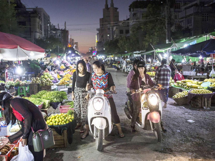 A night market in Mandalay. Chinese dominance in Myanmar’s economy is leaving the residents filled with hatred as the immigrants get richer, scooping up jade and timber for the market back home. Photo: The New York Times