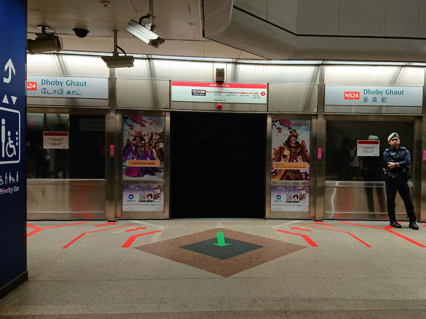 The platform screens at Dhoby Ghaut station on May 17. SMRT staff and officers from the Public Transport Security Command were seen at the platform after a door fault caused delays on the North-South line.