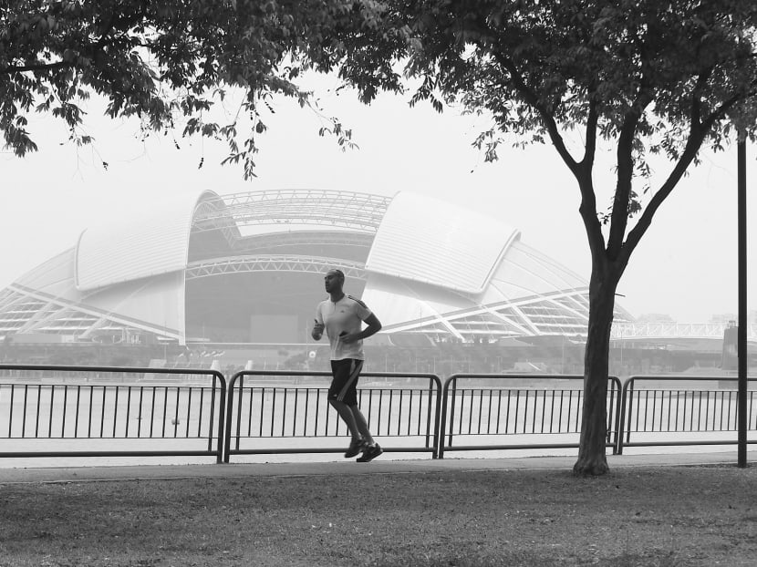 Haze in the area around the Sports Hub yesterday. Even if the haze persists for 24 hours or longer, it may not be easy to enforce the new law. Photo: Wee Teck Hian
