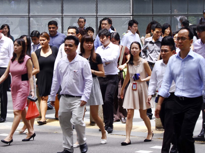 TODAY file photo of office workers at Raffles Place.