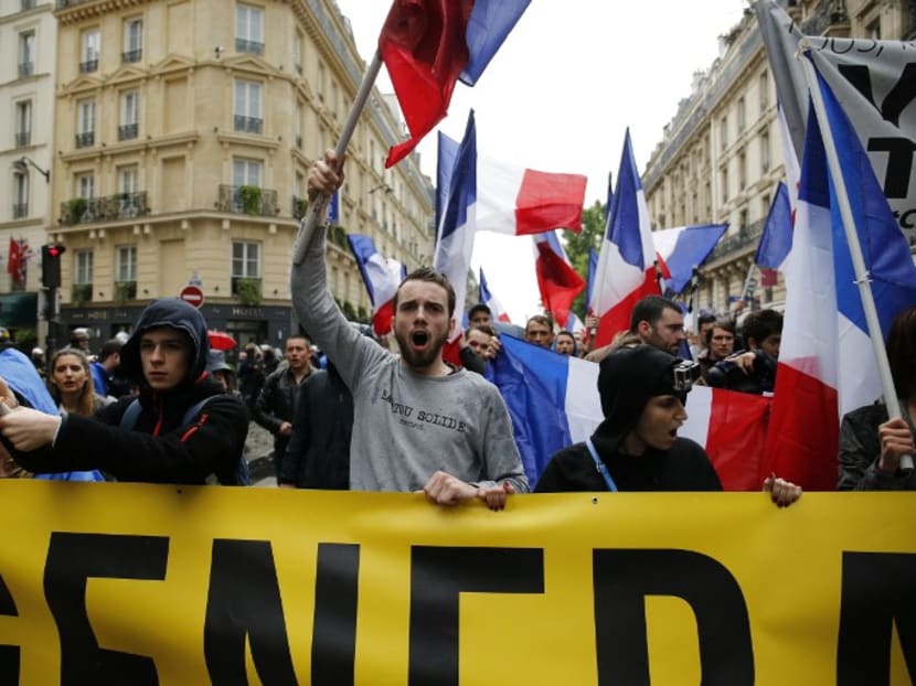 Member of a French far-right movement demonstrating in Paris against migrants last year. Photo: AFP
