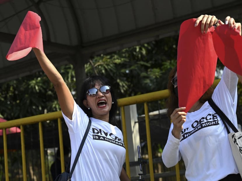 This photo taken on February 14, 2023 shows Stella Sibonga (left), a pro-divorce advocate, taking part in a demonstration on Valentine's Day in front of the Senate Building in Pasay, Metro Manila, the Philippines.