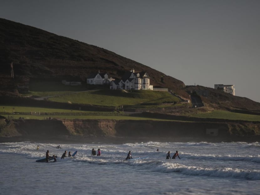 Members of Wave Wahines, a women- and girls-only surf club, during a lesson off Croyde Beach in North Devon, England on Oct 10, 2022. 