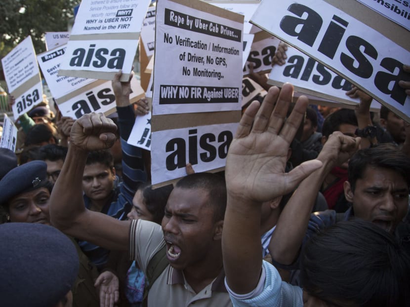 Protestors from All India Students Association (AISA) demonstrate outside the Delhi Police headquarters after a taxi driver from the international cab-booking service Uber allegedly raped a young woman Friday in New Delhi, India, Sunday, Dec. 7, 2014. Photo: AP