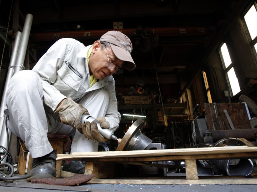 With nearly 27 per cent of Japan’s population aged 65 or older, seniority is being appreciated with workers encouraged to stay on and impart their skills and experience to a younger workforce. PHOTO: REUTERS