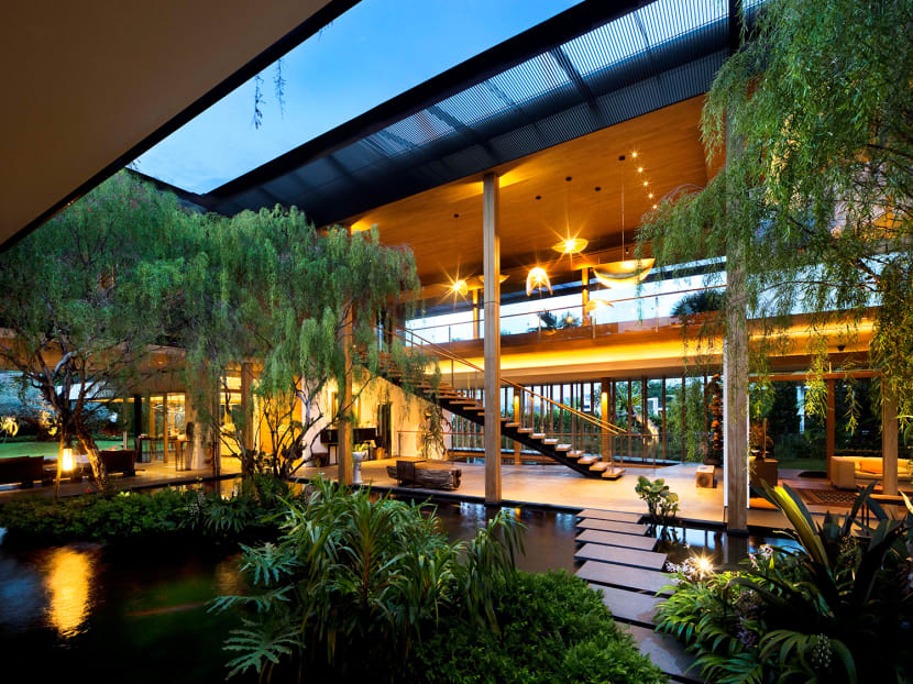 This spacious good class bungalow in Singapore is a tropical oasis filled with ponds and plants This spacious good class bungalow in Singapore is a tropical oasis filled with ponds and plants