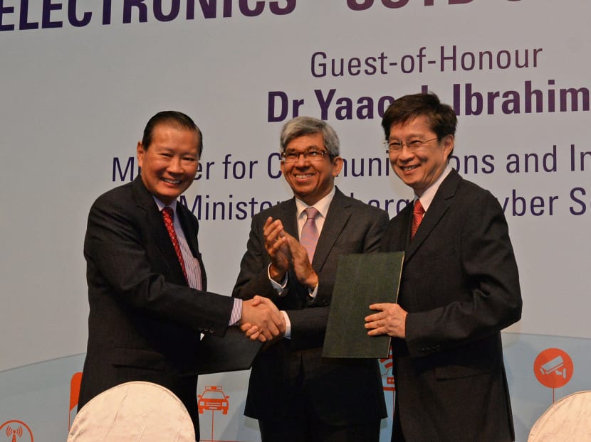 A S$44.3 million cyber security lab will be set up by August following the inking of a partnership between Singapore Technologies Electronics (ST-Electronics) and the Singapore University of Technology and Design (SUTD). From left to right: Mr Lee Fook Sun, President of ST Electronics, Dr Yaacob Ibrahim, Minister for Communications and Information, Professor Chong Tow Chong, Provost of SUTD, at the signing event and launch on May 13.  Photo: Robin Choo/TODAY