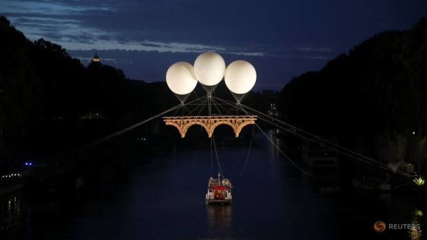 Michelangelo-inspired cardboard bridge floats above Rome's Tiber river Michelangelo-inspired cardboard bridge floats above Rome's Tiber river