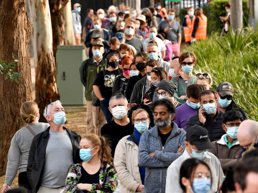 Sydneysiders queue outside a vaccination centre in Sydney on June 24, 2021, as residents were largely banned from leaving the city to stop a growing outbreak of the highly contagious Delta Covid-19 variant spreading to other regions.