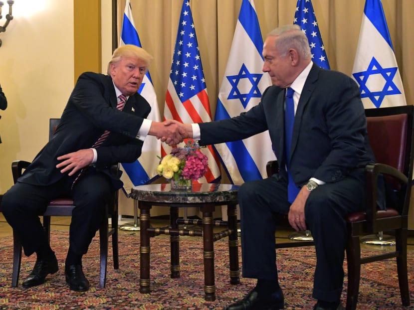 US President Donald Trump and Israel's Prime Minister Benjamin Benjamin Netanyahu shaking hands as they speak to the press ahead of a bilateral meeting at a hotel in Jerusalem on May 22, 2017. Photo: AFP
