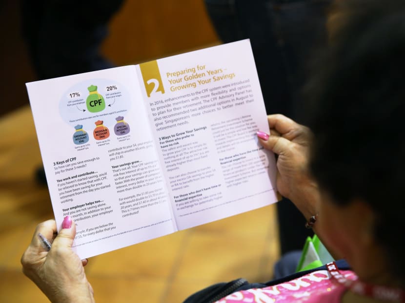 A resident reading the CPF - Planning for Retirement brochure. TODAY file photo