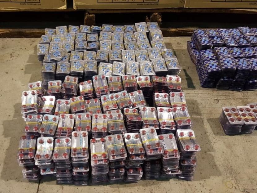 Immigration officers conducting routine checks on Monday (Oct 9) uncovered four crates worth of sexual enhancement drugs estimated to be worth S$178,000 at a warehouse in Gul Way. Photo: Immigration & Checkpoint Authority