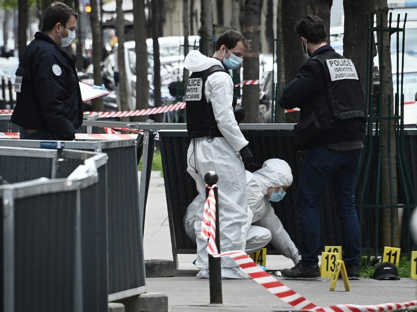 French police forensic investigators search for evidence near the Henry Dunant private hospital where one person was shot dead and one injured in a shooting outside the instituion owned by the Red Cross in Paris' upmarket 16th district on April 12, 2021.