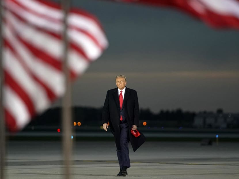 US President Donald Trump arrives for a Make America Great Again campaign event at Des Moines International Airport in Des Moines, Iowa on October 14, 2020.