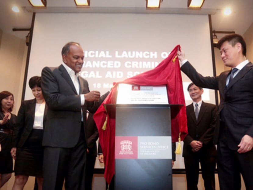 Minister K Shanmugam and president of the law society of singapore Thio Shen Yi unveil a plaque at the official launch of CLAS on May 18, 2015. Photo: Jason Quah
