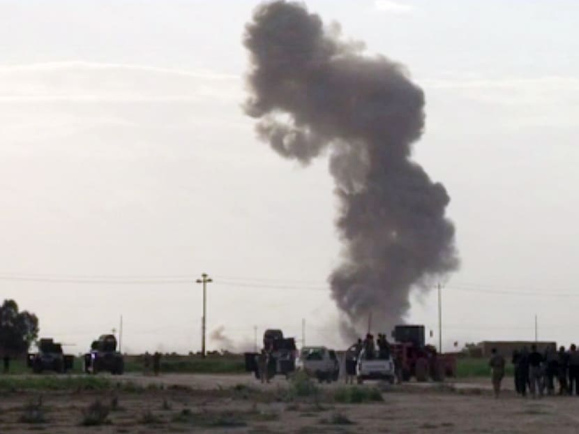 In this image made from video, smoke rises from an explosion as Iraqi forces, Shiite militiamen and Sunni tribal fighters battle Islamic State militants for control of Tikrit, Iraq, on Tuesday, March 3, 2015. Photo: AP