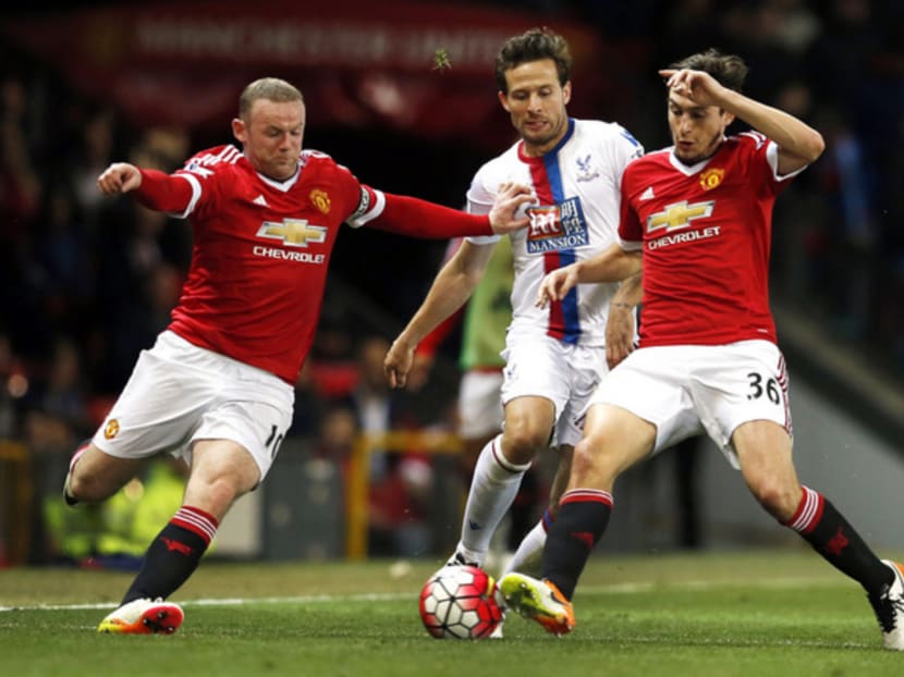 Manchester United’s Wayne Rooney (right) — with Matteo Darmian and Palace’s Yohan Cabaye — is tipped to destroy his opponents in the final. Photo: Reuters