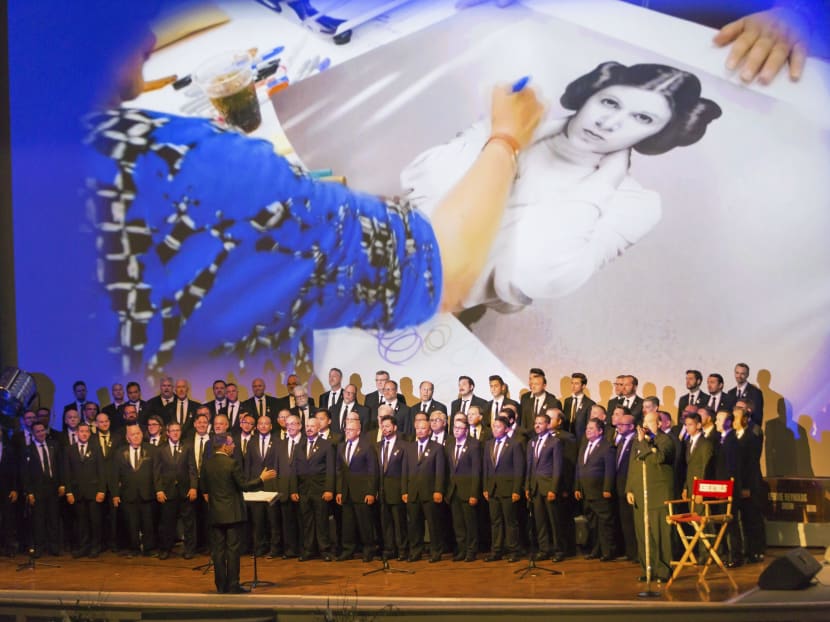 The Gay Men's Chorus of Los Angeles performs at the Carrie Fisher and Debbie Reynolds Memorial Service at The Forest Lawn in Los Angeles. Photos: Invision/AP