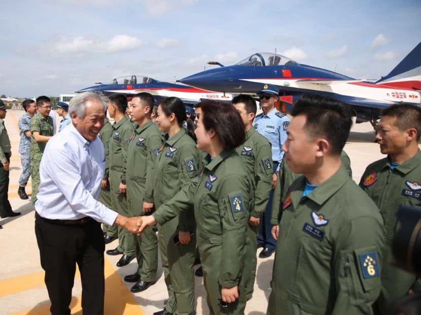 Defence Minister Ng Eng Hen meeting members of the Ba Yi aerobatics team of the People's Liberation Army Air Force at Changi Air Base on Feb 7, 2020.
