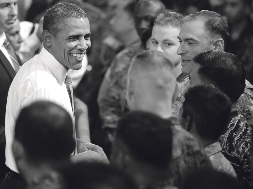 Mr Obama 
meeting US and 
Philippine troops in Manila in April. US security is closely linked to peaceful development in the Asia-Pacific. Photo: AP