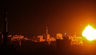 Israel bombs Gaza, fights Hamas around hospitals