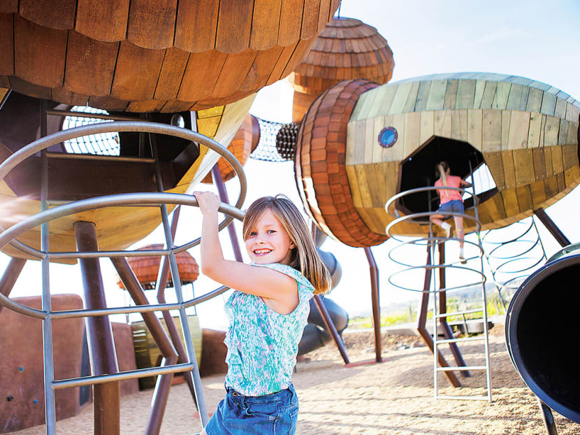 Take your kids to the National Arboretum Canberra and play at the Pod Playground, which features giant acorn cubbies, nest swings and banksia pods. Photos: VisitCanberra