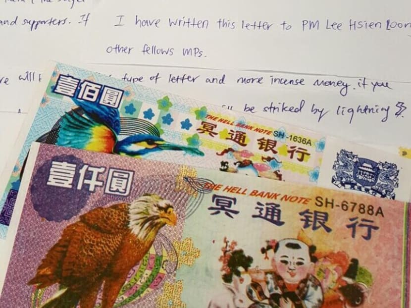 Hell notes are seen along with a letter addressed to Prime Minister Lee Hsien Loong and MPs. Hell notes are seen along with a letter addressed to Prime Minister Lee Hsien Loong and MPs.