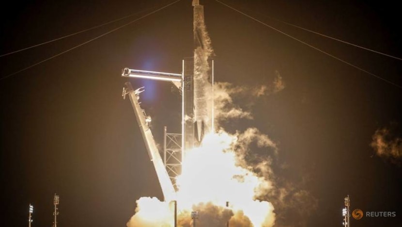 SpaceX capsule, carrying four astronauts, docks with International Space Station SpaceX capsule, carrying four astronauts, docks with International Space Station