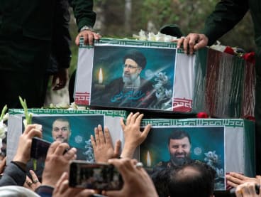 A picture of the late Iranian President Ebrahim Raisi is seen on his coffin during a funeral ceremony held in Tabriz, East Azerbaijan Province, Iran on May 21, 2024. REUTERS