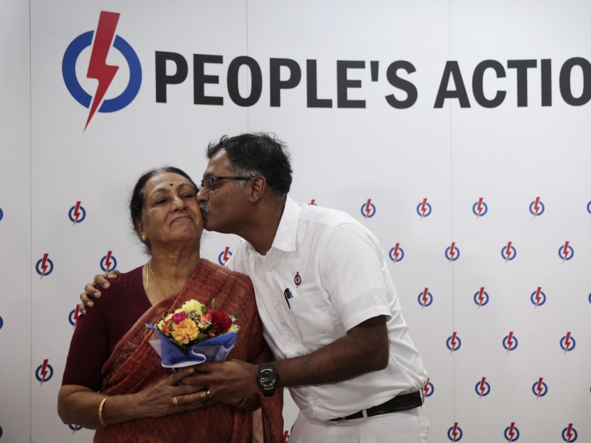PAP's Murali Pillai kisses his mother Madam Vasanthi Ramadass at the end of a press conference following his victory in the Bukit Batok by-election. Photo: Jason Quah