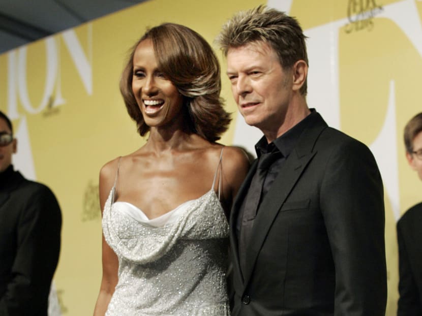 In this 2005 file photo, singer David Bowie and his wife Iman pose at the 2005 CFDA Fashion Awards in New York. AP file photo