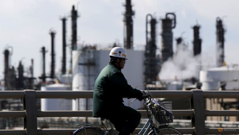 Japan cuts economic view on weaker production, spending due to COVID revival Japan cuts economic view on weaker production, spending due to COVID revival