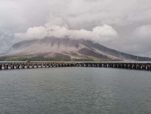 A handout photo taken and released by Center for Volcanology and Geological Hazard Mitigation on April 18, 2024 shows Mount Ruang spewing smoke in Sitaro, North Sulawesi. 